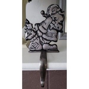 Cast Iron Stocking Holder,  SANTA HOLDING BAG OF TOYS